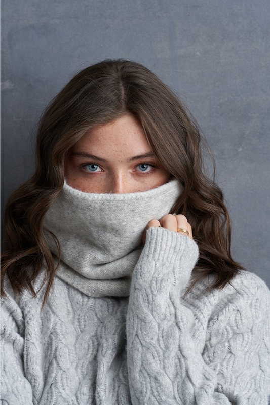 Brunette Blue Eye Caucasian Female wearing a Woven Ribbed-knit  Warm  Soft  Casual  Cozy  Stretchy Multipurpose headwear or scarf  Easy Slip-On Snood paired with a ribbed turtleneck sweater