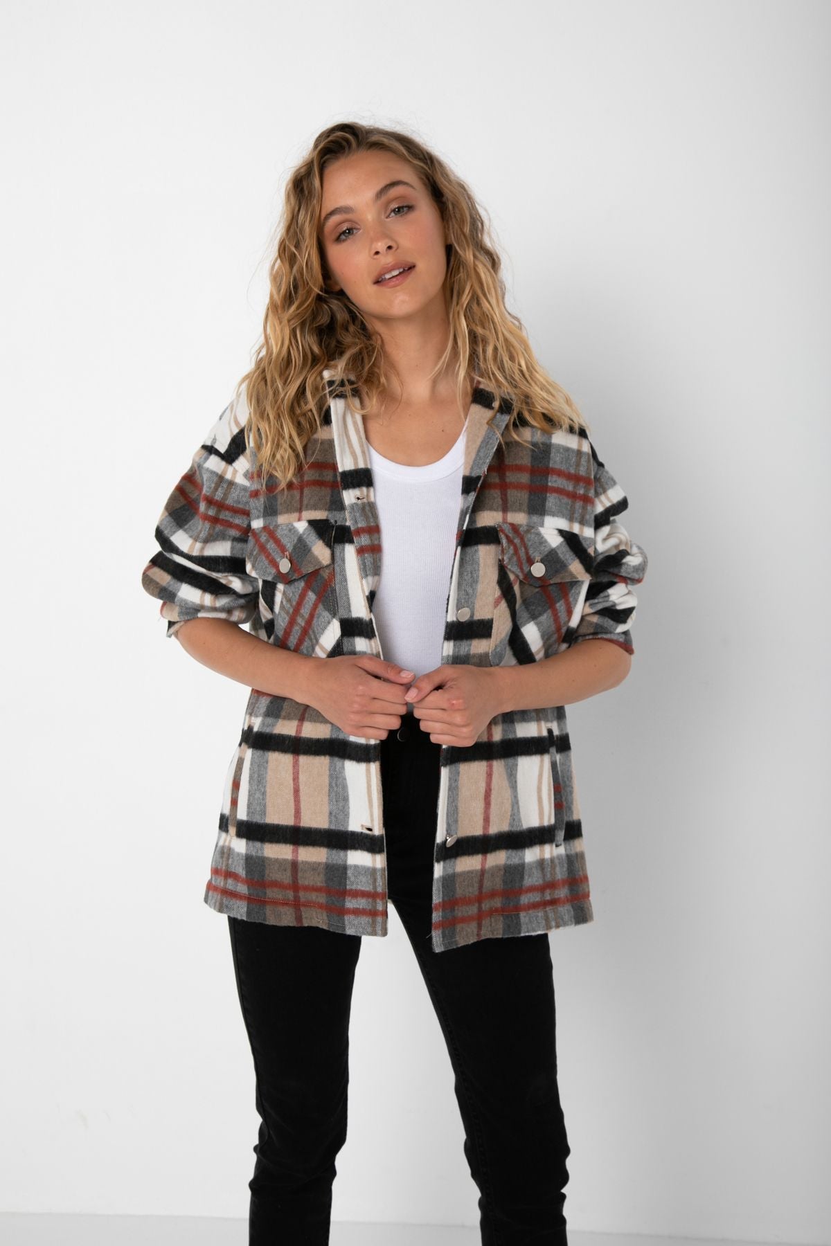 Tall Curled Blonde Caucasian female wearing a Two Squared Front Pockets  Buttoned Down Shacket  Lightweight  Turndown collar  Casual Rolled Up Sleeves  Relax fit  Long sleeve  Flannel Jacket  Oversized plaid jacket Short Fall Jackets paired with black denim jeans