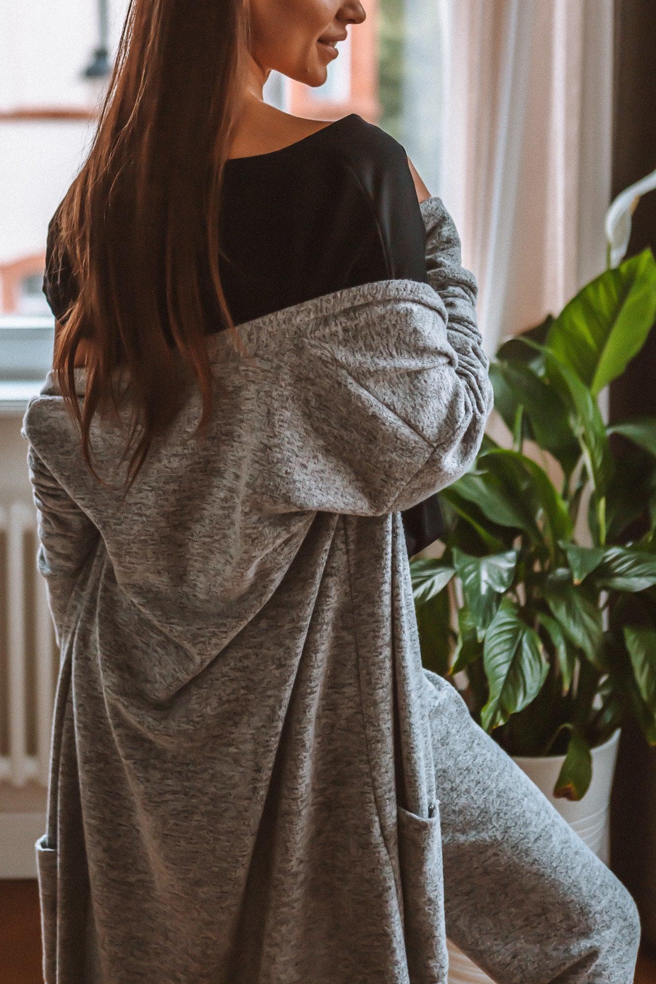 Brunette Caucasian Female Wearing a Mid-Length Cardigan  Open Front  Long Sleeved  Versatile  Lightweight  Two side pockets 