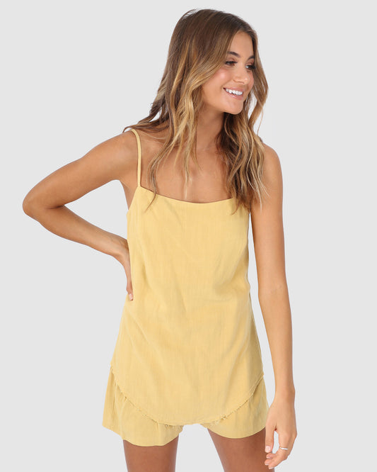 Bailage Haired Caucasian Female wearing Spaghetti Adjustable Straps  Lightweight  Scoop Hemline  Soft Fabric  Casual  Basic  Low-Scoop Neck  Undershirt Camisole Linen-Blend Cami Tank Top in  Honey Yellow 